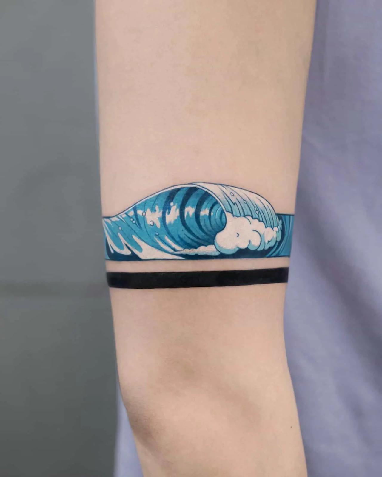 Close up view of the armband wave tattoo