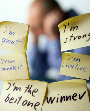 Words of affirmation post-its in the mirror