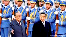 Chinese President Yang Shangkun(L) and Japanese Emperor Akihito review the honor guard in front of the Great Hall of the People in Beijing,23 October1992. Akihito arrived in China23 October1992, to mark the20th anniversary of Sino-Japanese diplomatic relations.(Photo credit should read MIKE FIALA/AFP/GettyImages)