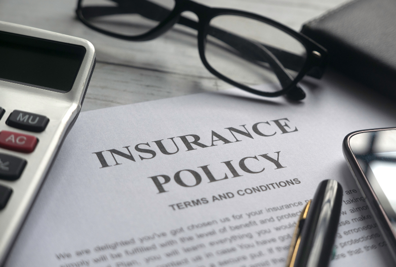 Insurance policy terms and conditions written in paper.