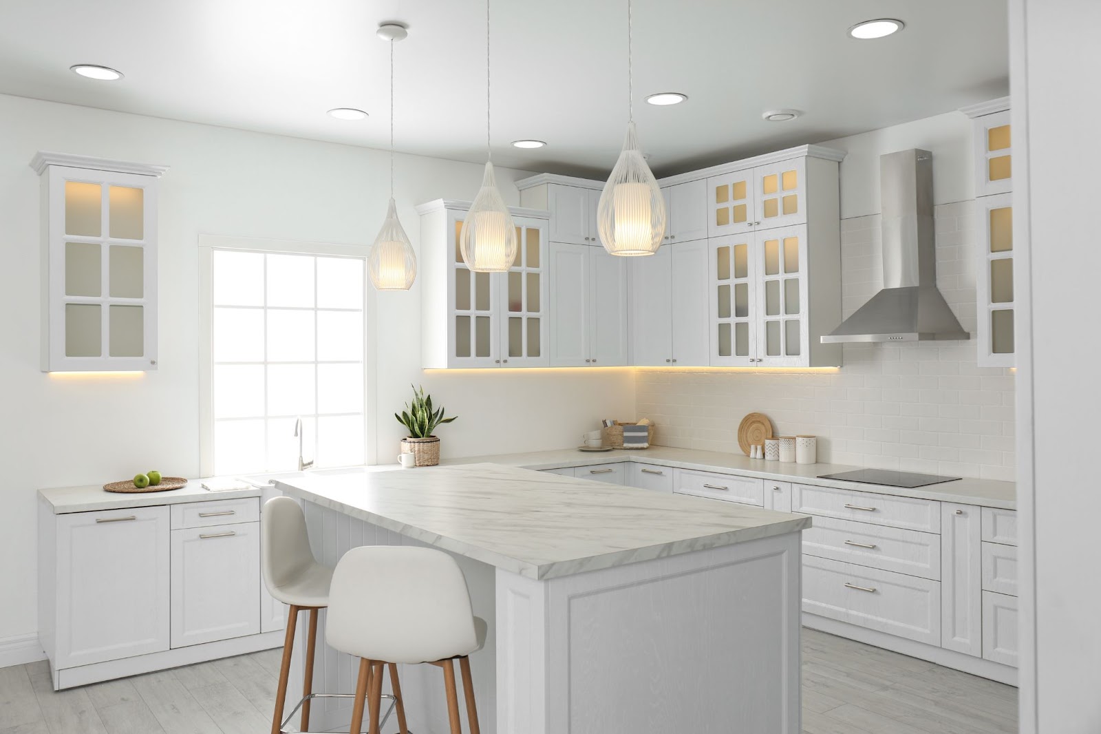 clean and beautiful white kitchen with white countertops