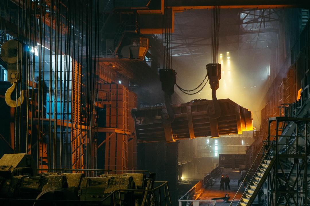Manufacturing in a factory with a crane scale being used to lift an object