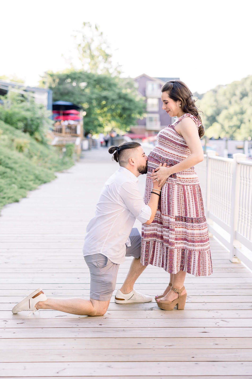 Husband kissing pregnant wife's belly