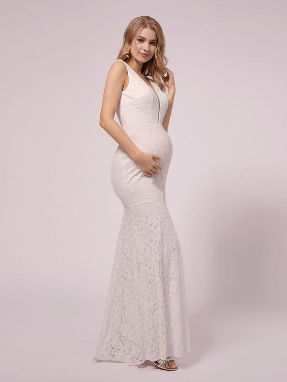 a lady wearing a trumpet wedding dress for maternity