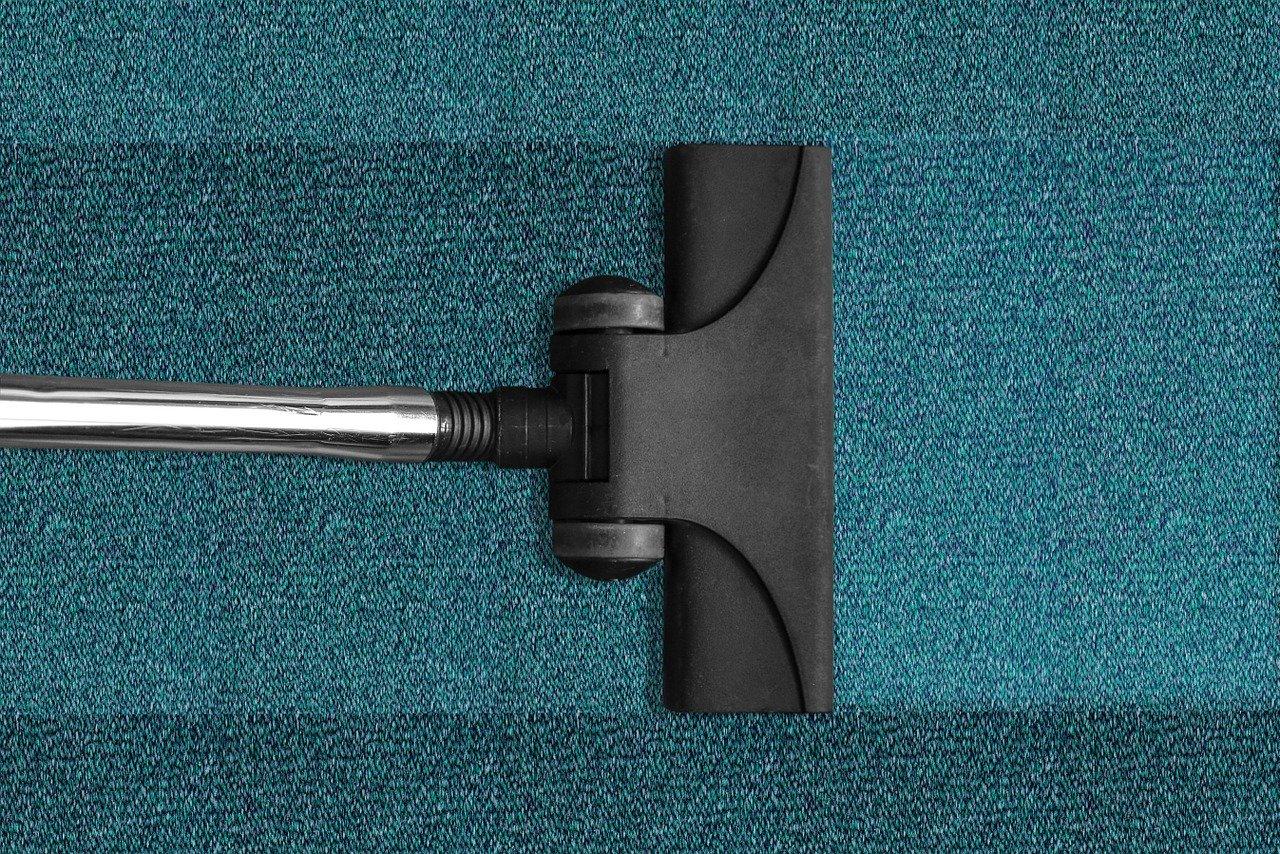 a vacuum cleaner vacuuming the floor