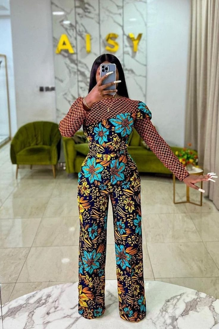 lady taking mirror selfie wearing mixed print ankara outfit