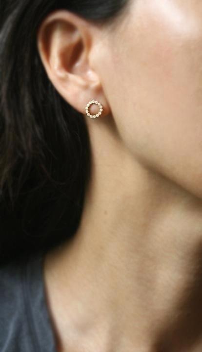 Tiny flat round circles make up the small round stud earring. The earrings are approx. 3/8" in diameter. In 14k gold. Also available with diamonds as well as in #trendywomenwatches