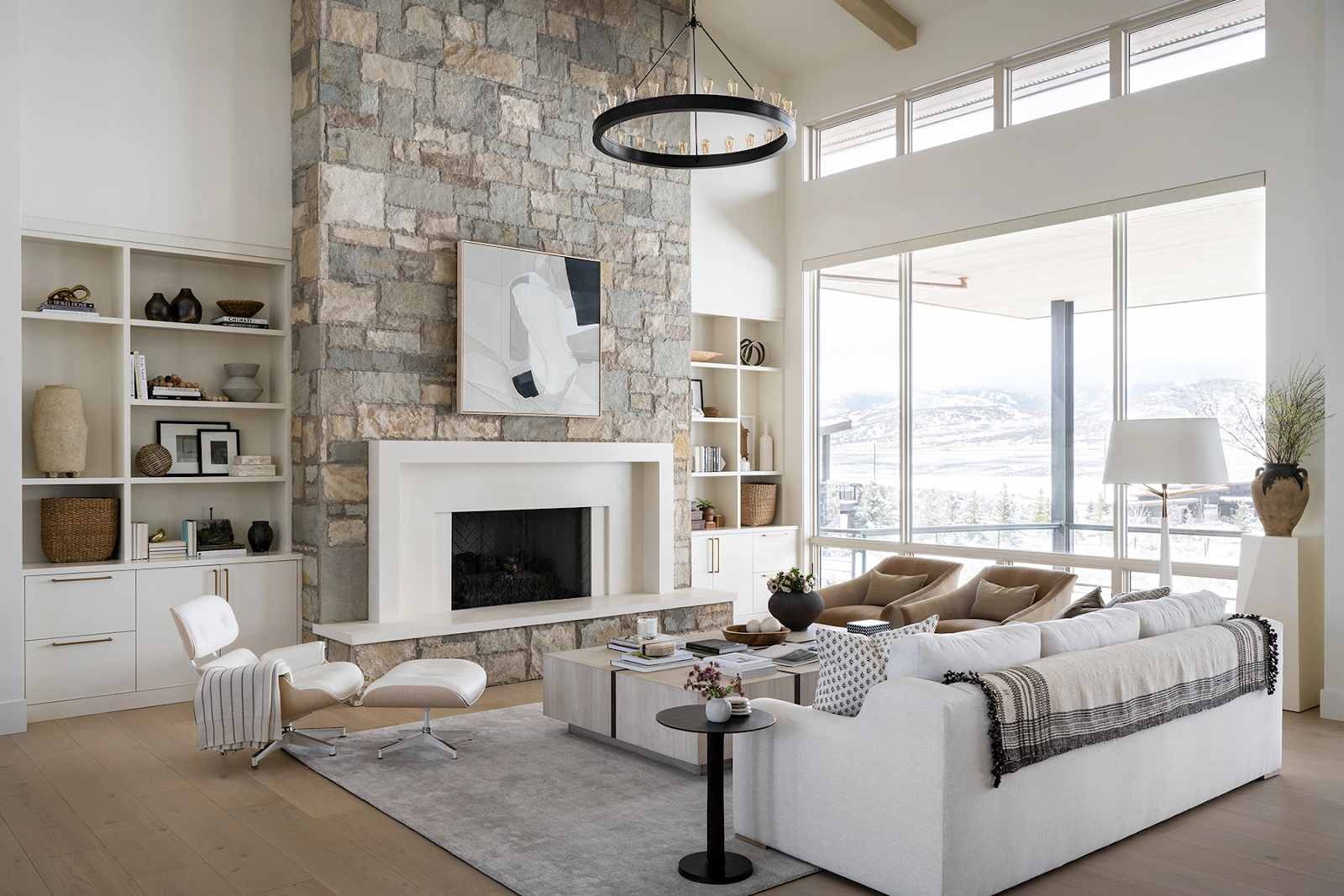 Contemporary Living Room with stone fireplace surround