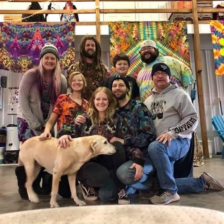 Even dogs love tie-dye designs! Members of the Tie-Dyeing community met up at an aircraft hangar in Carmi, Illinois, for a dye session where one dyer’s wife flys planes out of. (From left to right: Jaime Lemming, Bri Klein, Landon Bennett, Kelton, George Zeller, Louisa Daniel, Mark Czerniejewski, Kurt Wallace)