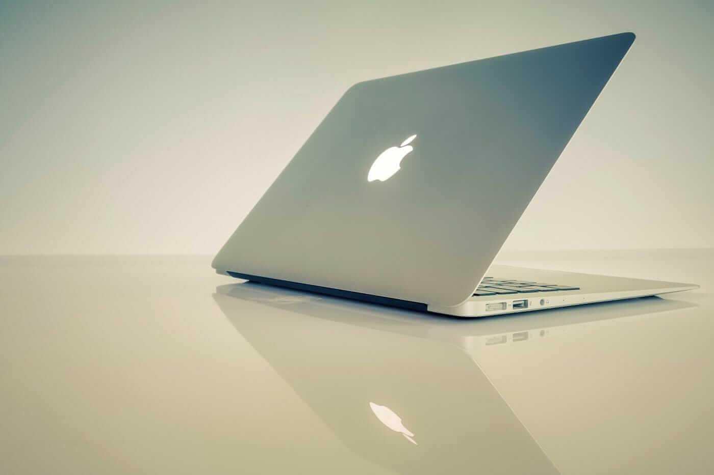 A computer with a logo on it

Description automatically generated