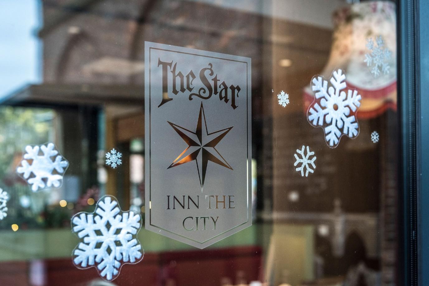 May be an image of text that says "TheStar INN THE CITY"