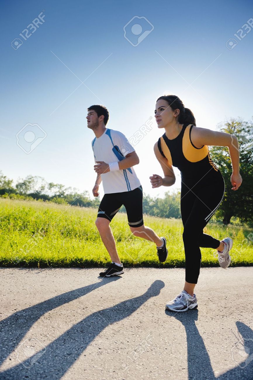 14680337-Young-couple-jogging-in-park-at-morning-Health-and-fitness--Stock-Photo.jpg