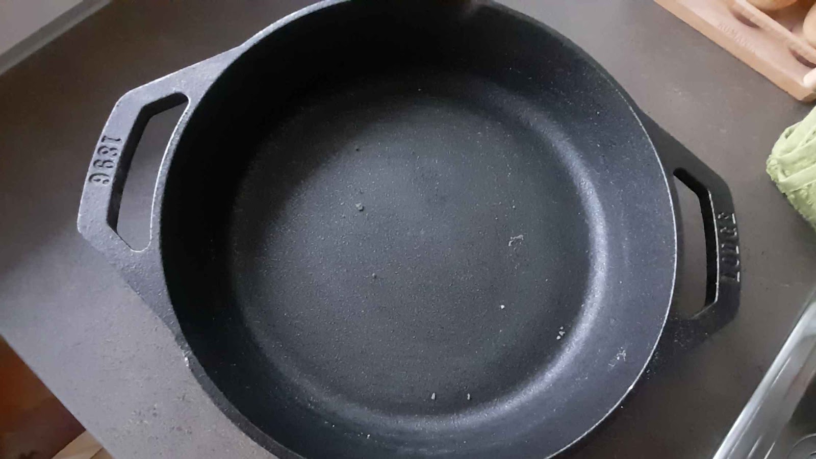 Skillet after scrubbing with steel sponge and baking soda.