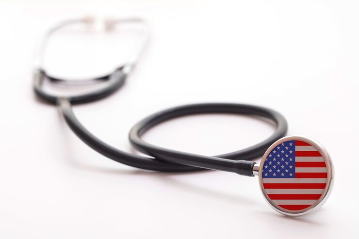 A medical stethoscope with the flag of the United States, representing the healthcare concept in the USA.