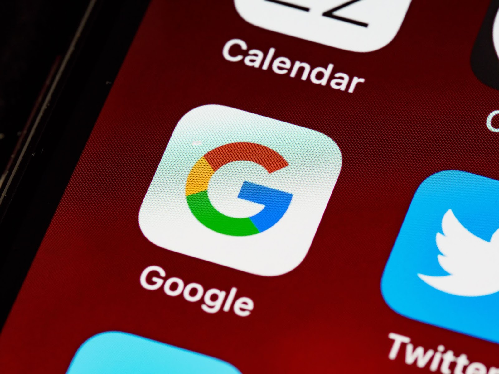 a photo of a Google app icon on a mobile screen