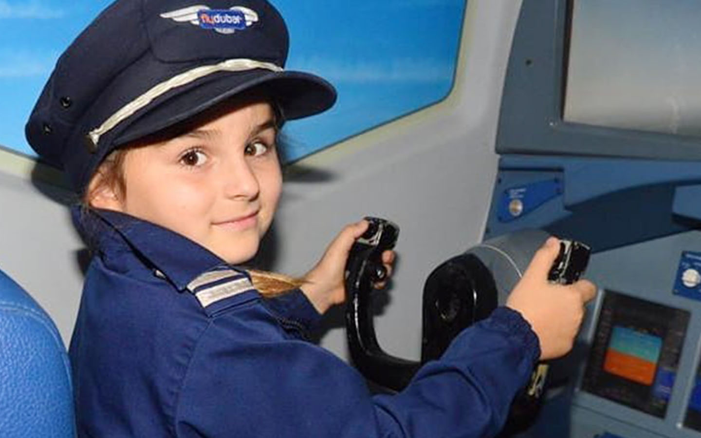 A kid flying a simulator