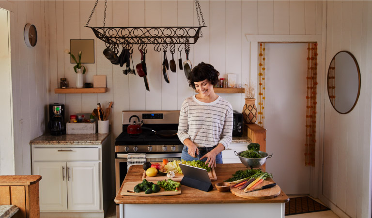 A woman cooking a recipe on her repurposed kitchen island