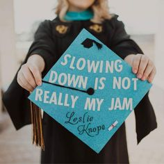 A graduation cap that reads "Slowing down is not really my jam - Leslie Knope"