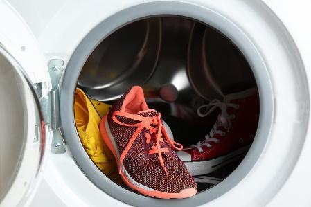 A pair of red shoes in a dryer

Description automatically generated with medium confidence
