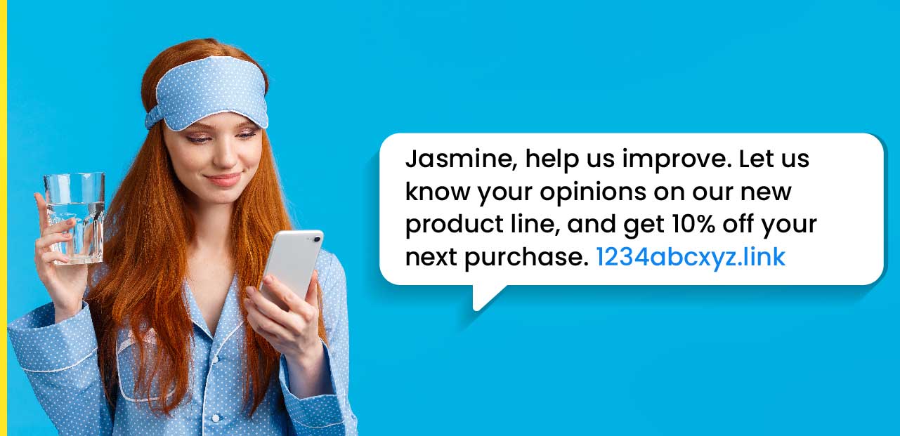 Test and analyse your SMS | A female in a blue shirt and matching eye mask smiles as she reads a classy SMS message from her favourite brand in a blue background.