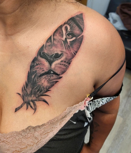 Feather With A "Lion" Chest Tattoo