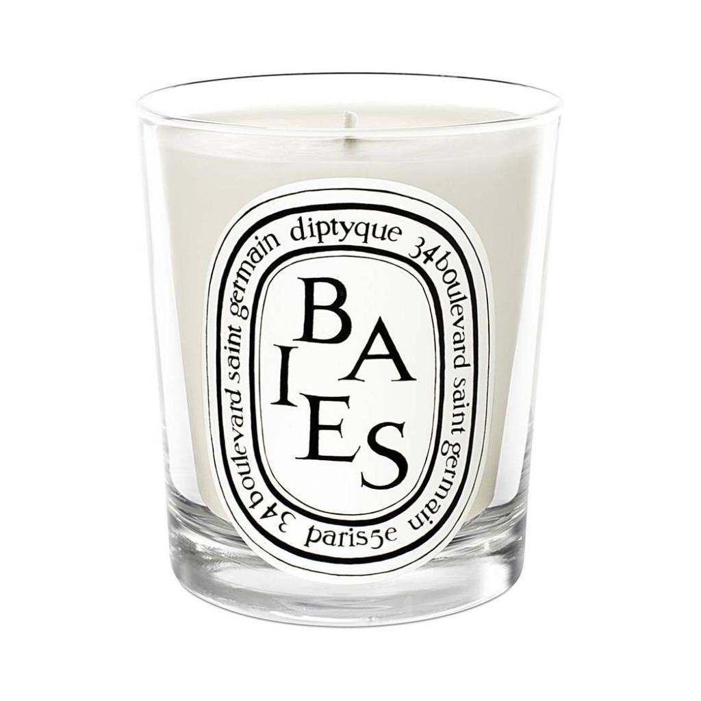 A white candle in a glass

Description automatically generated