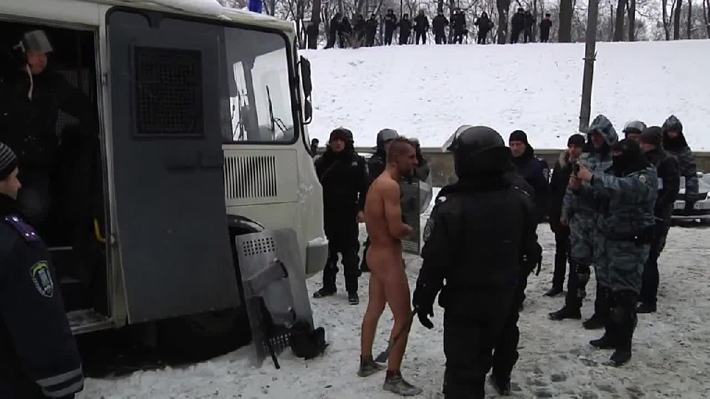 The Berkut riot police strip protester in -10°C during the Euromadain protests in winter of 2014 ~