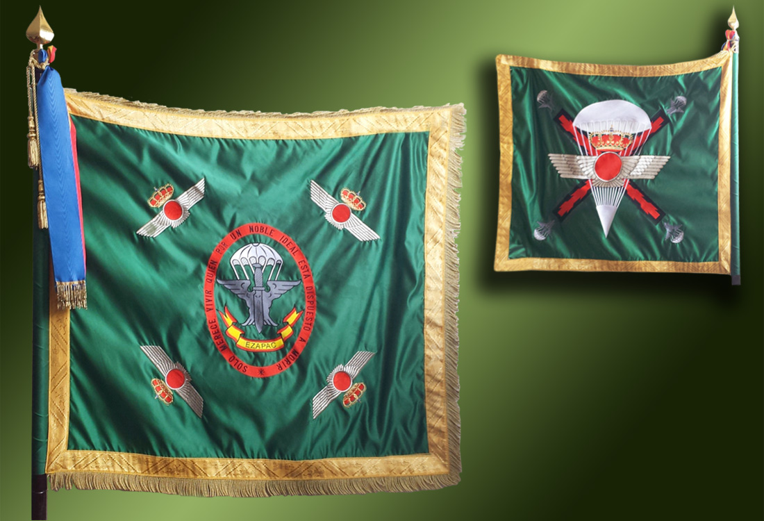 The unit's standard (left) consists of the shield described above on a green background Each corner has the Badge of the Spanish Air and Space Force.

The unit´s flag (right) consists of the Badge of the Spanish Air and Space Force with a parachute behind it on a green background. Behind this the Cross of Burgundy with a parachute in each corner.