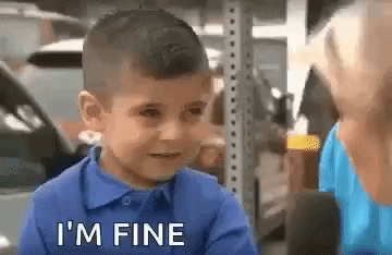 [Image description: a gif of a boy in a blue shirt being asked “how are you?” with the boy responding “I’m fine”,  he laughs, smiles and then his smile turns to a frown and he begins  to cry and cover his face with his hands]