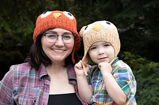 woman and toddler in owl hats