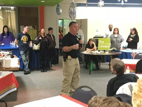 Chase Lydel, Indianapolis police department officer, speaks to a captive audience as the executive director of the decatur township drug free coalition