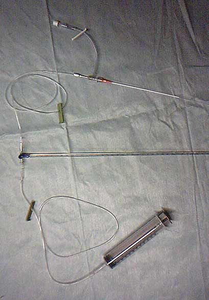 Set-up for central venous pressure measurement using a 60-ml syringe, extension tubing, stop-cock, manometer, 14-gauge needle, 3.5-French polypropylene catheter, and a 14-gauge catheter with T-port extension set. 