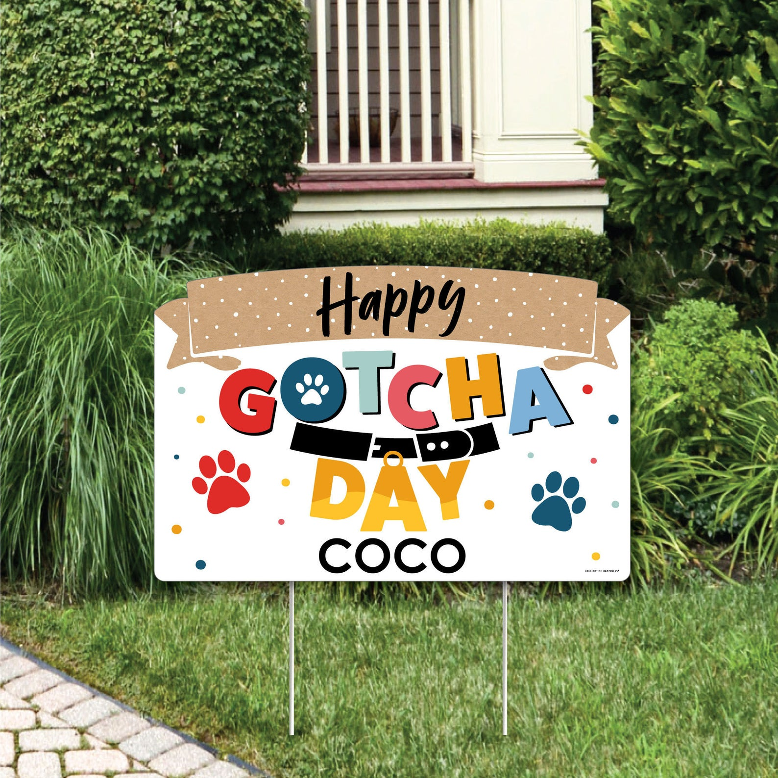 A colorful lawn sign that says "Happy Gotcha Day Coco"