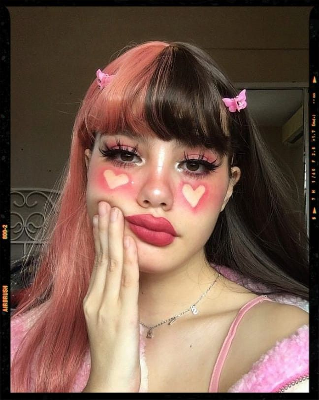 e-girl eyeliner look with negative space cheek hearts