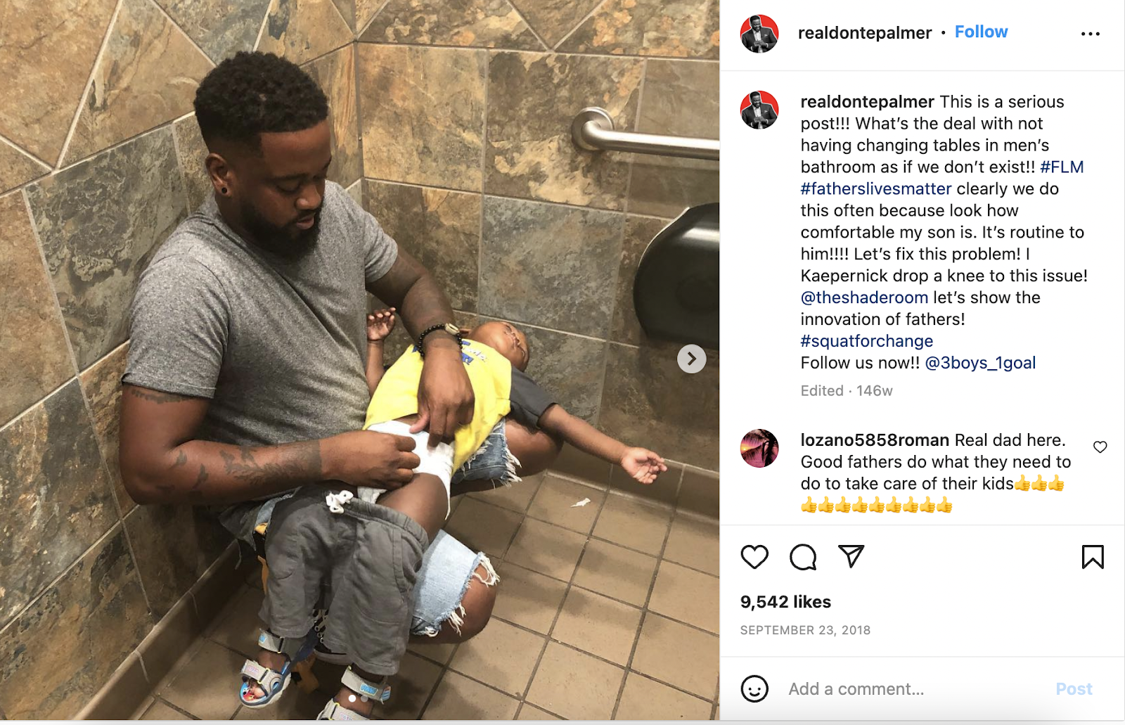 Photo of dad changing diaper in restroom