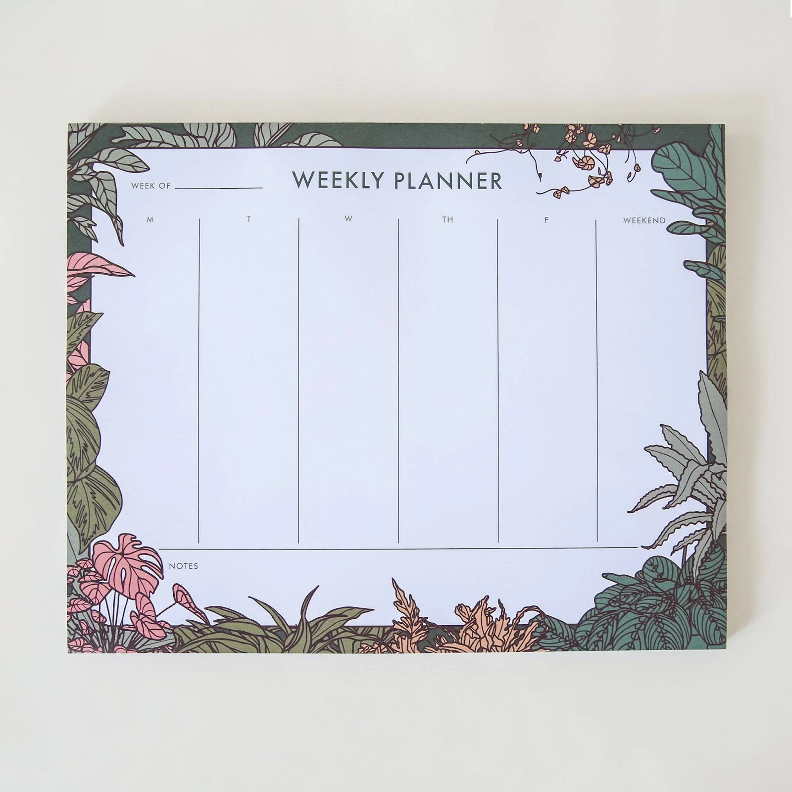 weekly planner pad decorated with plants