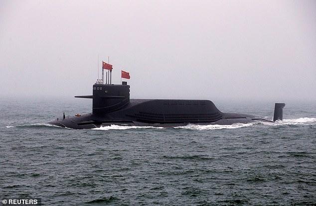 Illustrative photo shows the Long, a nuclear submarine, during a naval parade in 2019. 55 reportedly died after a Chinese nuclear submarine got caught in a trap in the Yellow Sea