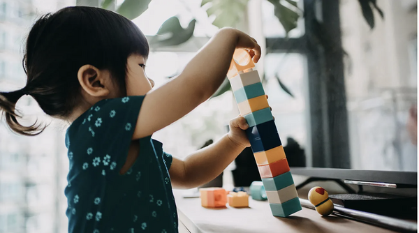 Child playing and building blocks 