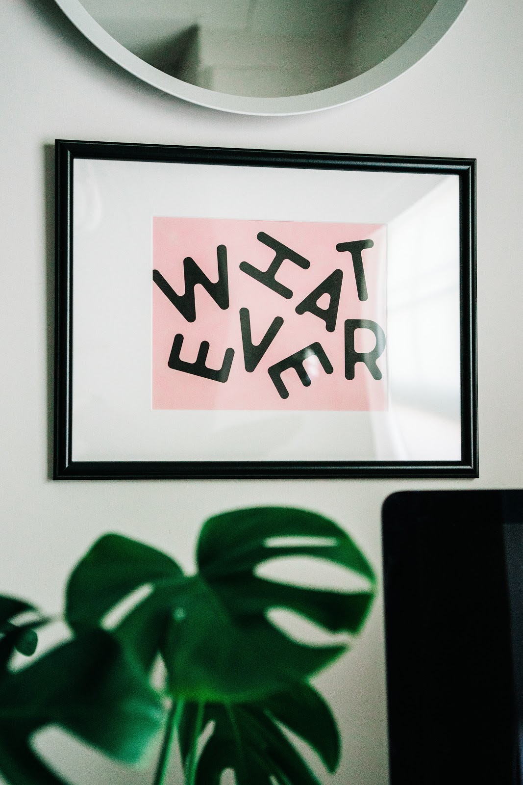 Picture frame with the word whatever in a chaotic design