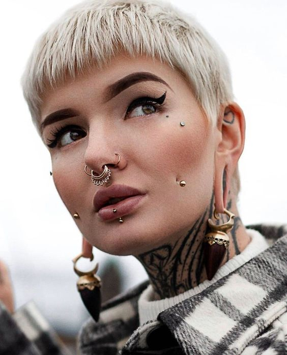 Close up view of a girl with face piercings