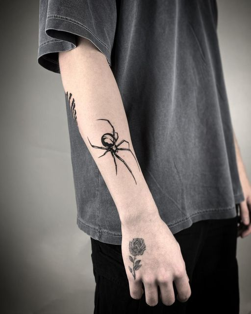 Another look of the spider tat on a guy's forearm