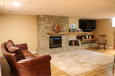 basement finishing and remodeling living area with furniture and TV custom built