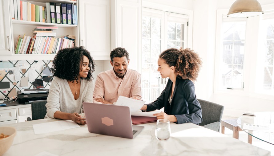 Couple consulting with a mortgage broker