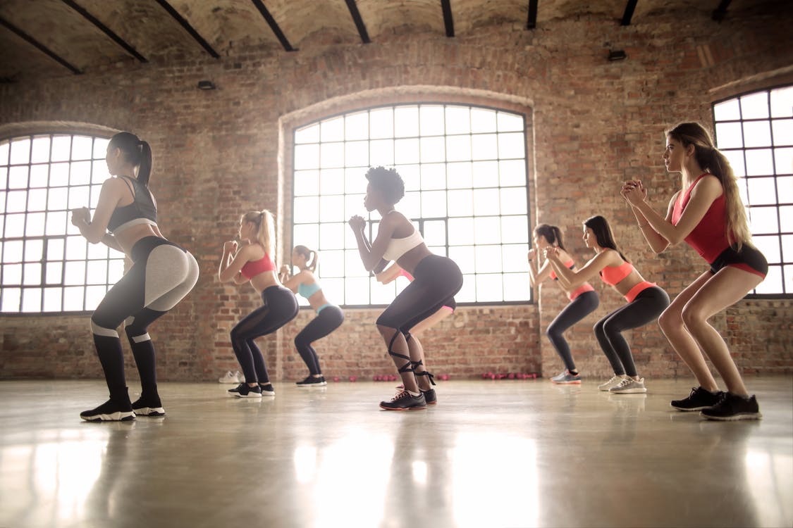 Free Group of Women Doing Exercise Inside The Building Stock Photo