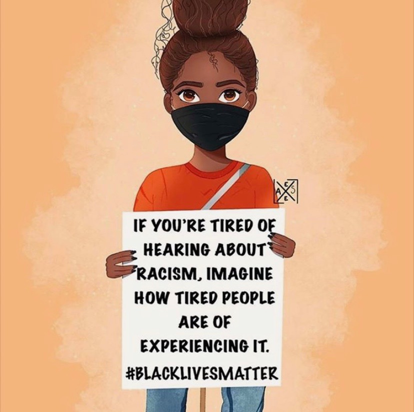 Girl holding #Blacklivesmatter poster