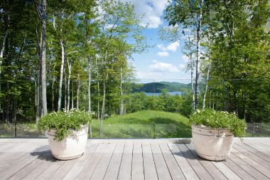 lake michigan deck with foliage and potted plants custom built