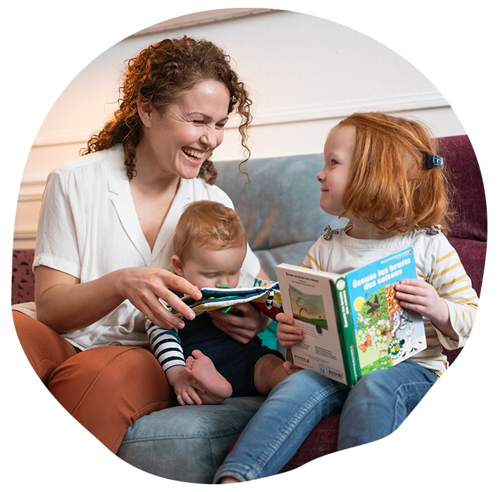 A person reading a book to a baby
Description automatically generated with medium confidence
