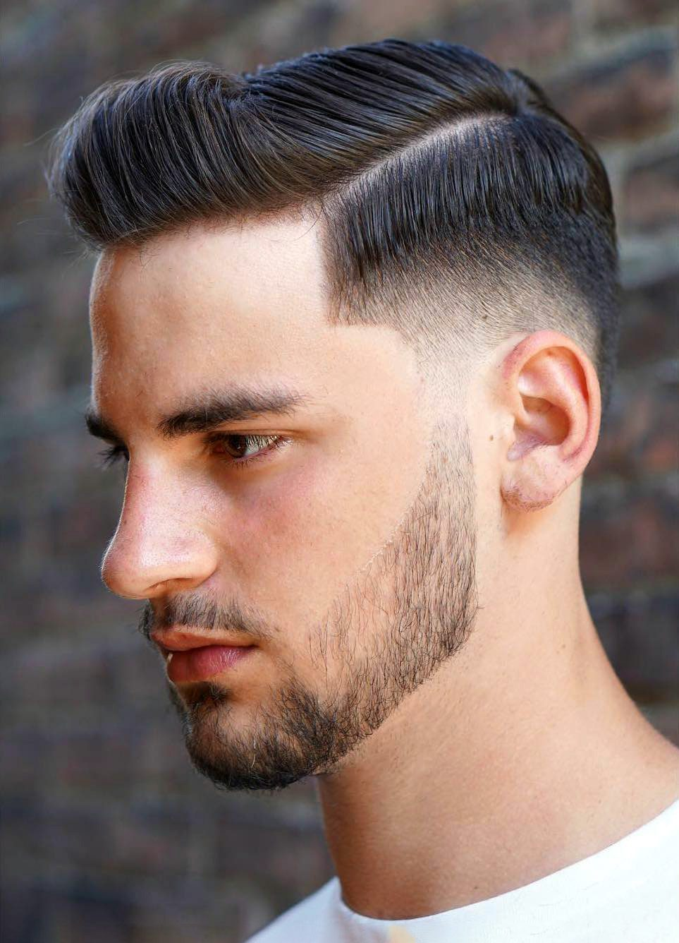 man rocking fade with short hair with beard
