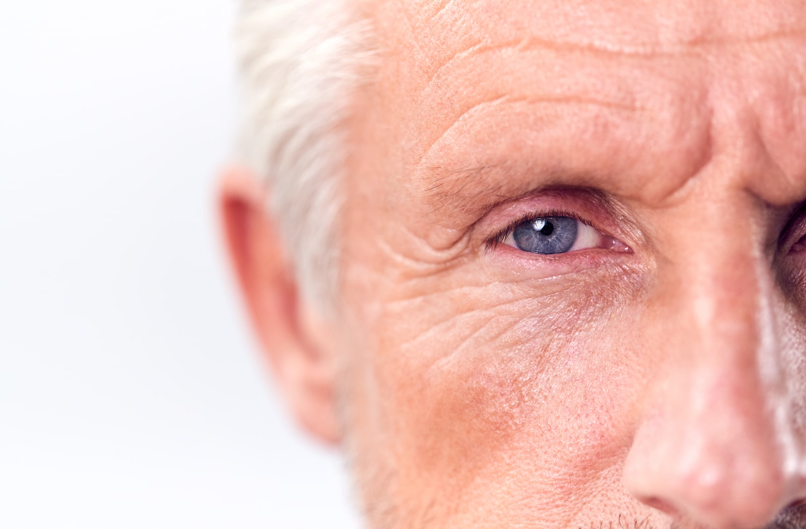 A close-up image of a older mans eye