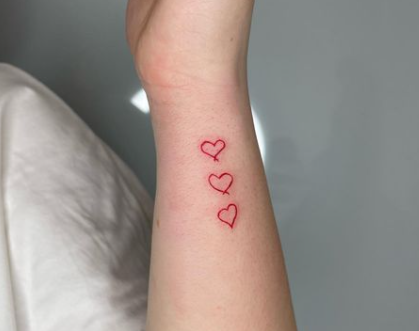 Three Tattoos On Wrist